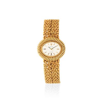 Rolex. A lady's 18K gold manual wind oval wristwatch 